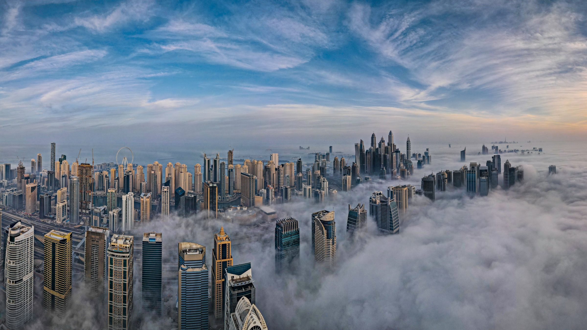 Dubai skyline above the clouds